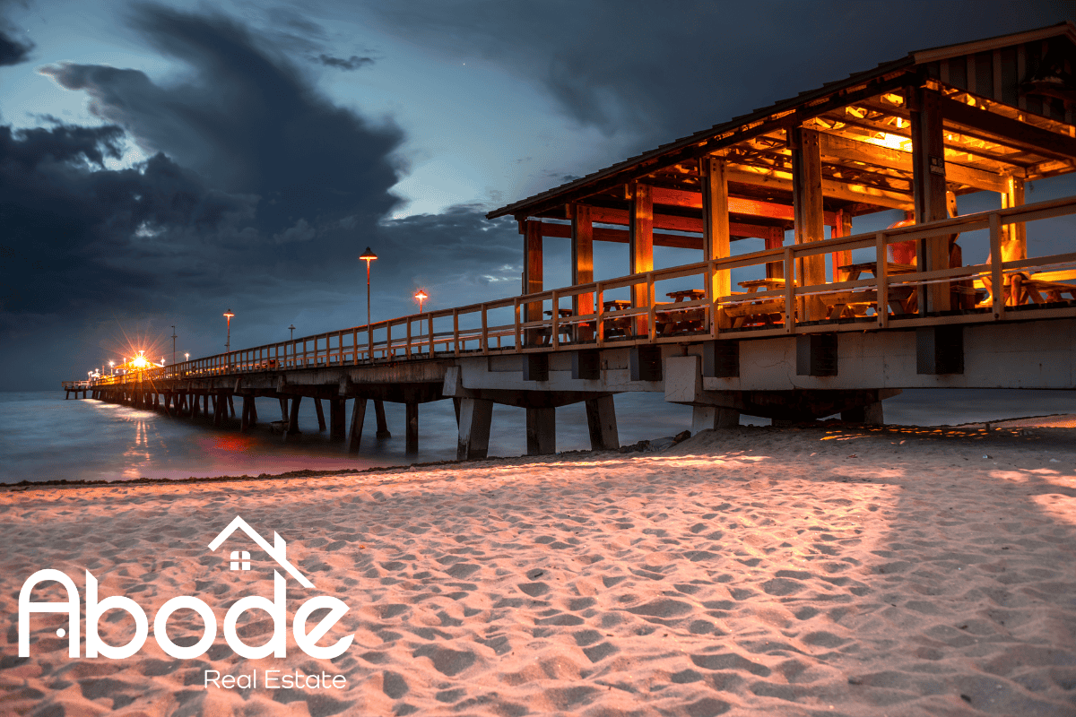 Coastal hotel exterior in Lauderdale By The Sea with palm trees