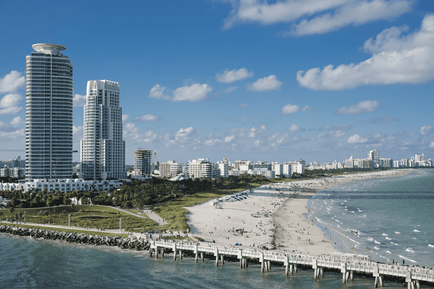 Aerial view of South Florida condominiums along the coast with the ocean in the background.
