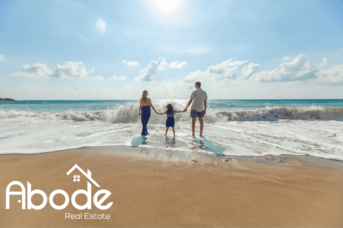 Sunny Lauderdale By The Sea sidewalk with people enjoying a leisurely walk.