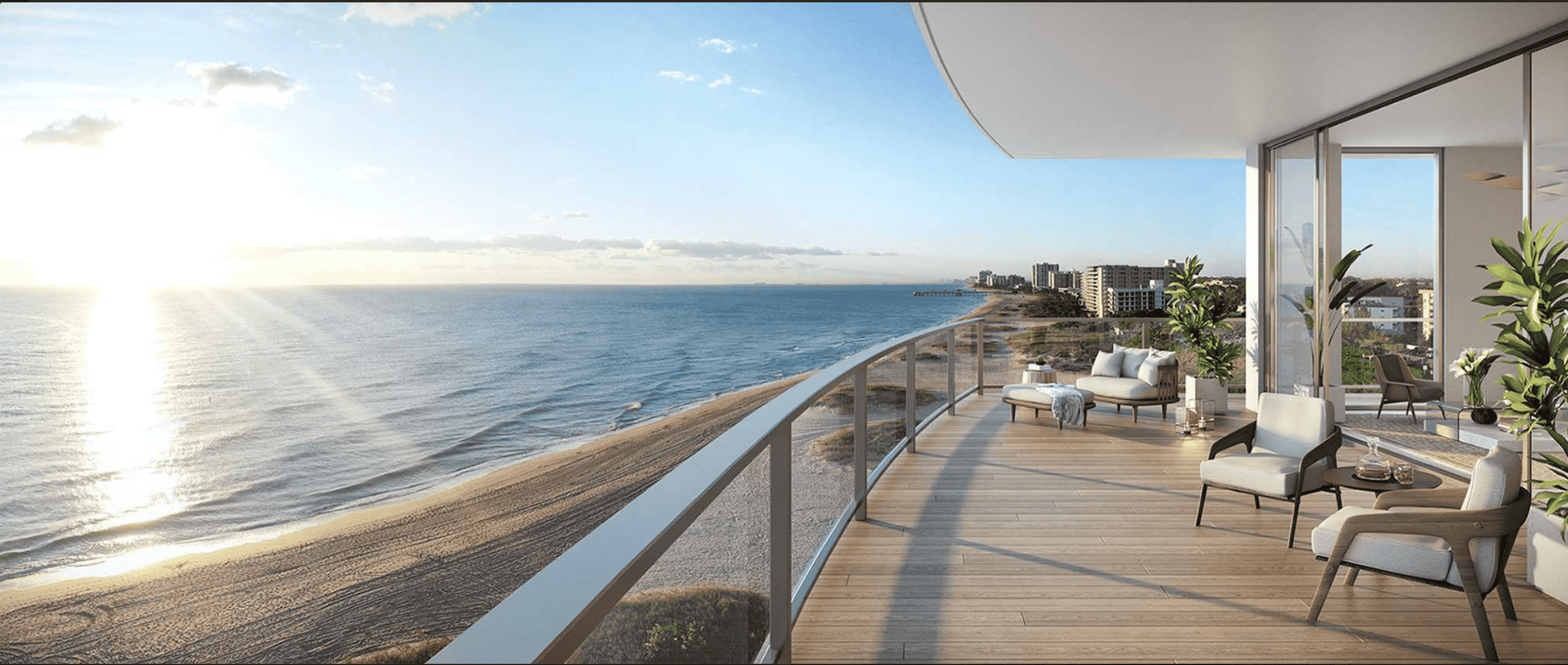 A view of Fort Lauderdale Beach with condos, palm trees, and a bright blue sky in the background.