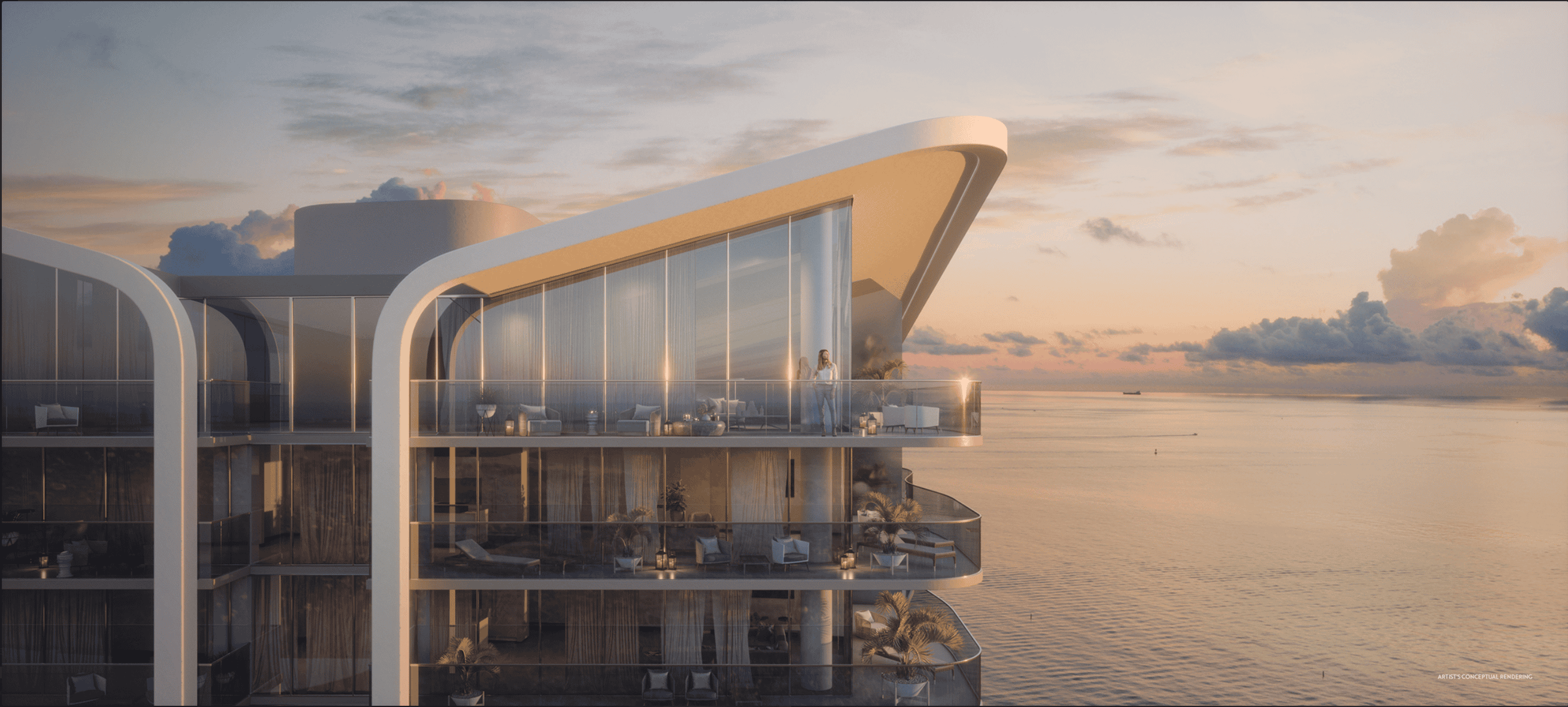 A view of Casamar Condominiums, a luxury oceanfront building in Pompano Beach, FL, with a beautiful sunset.